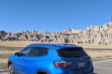 American road trip rental car blue jeep